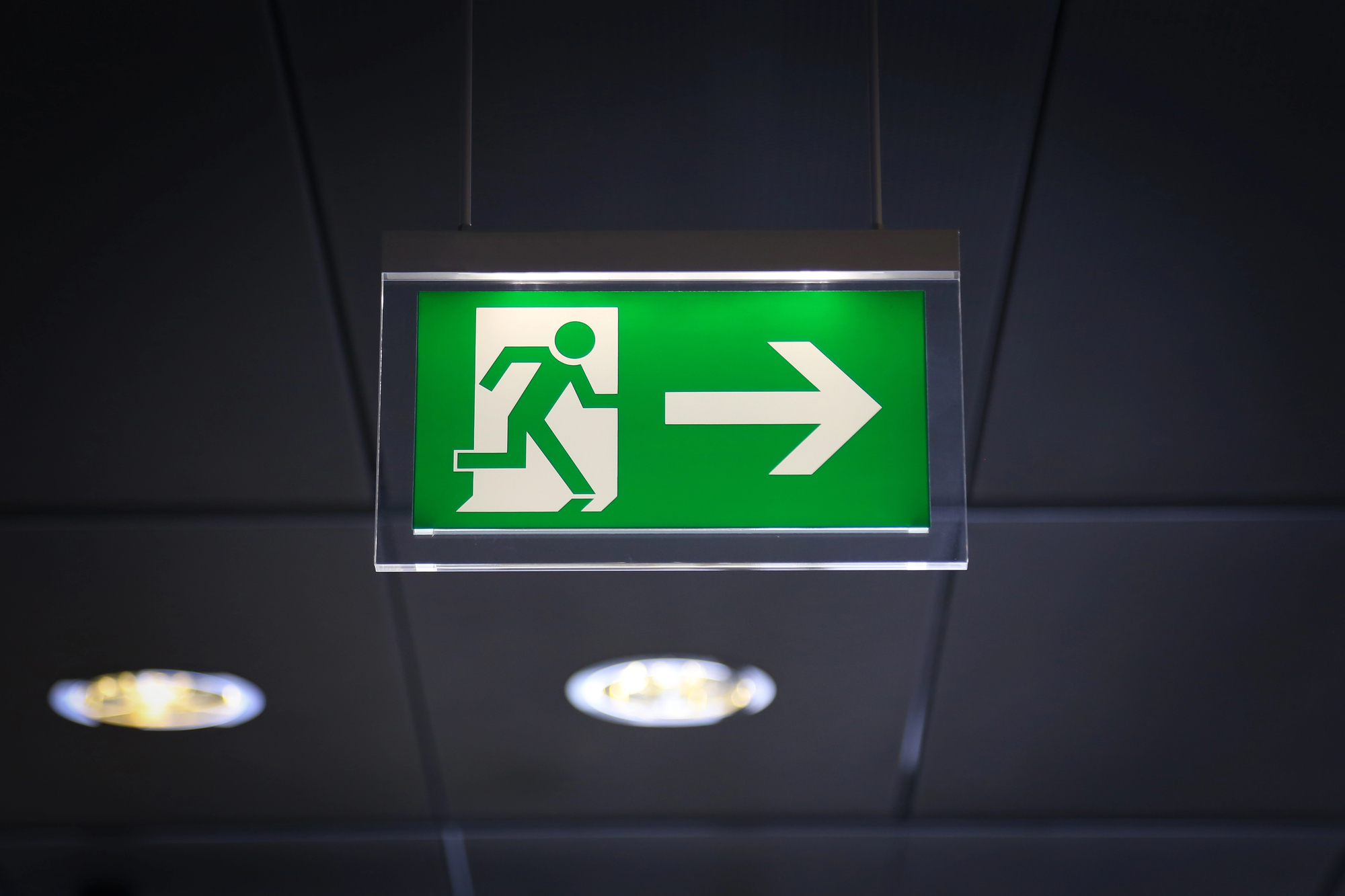 Commercial fire alarm supplier installs emergency exit safety signs