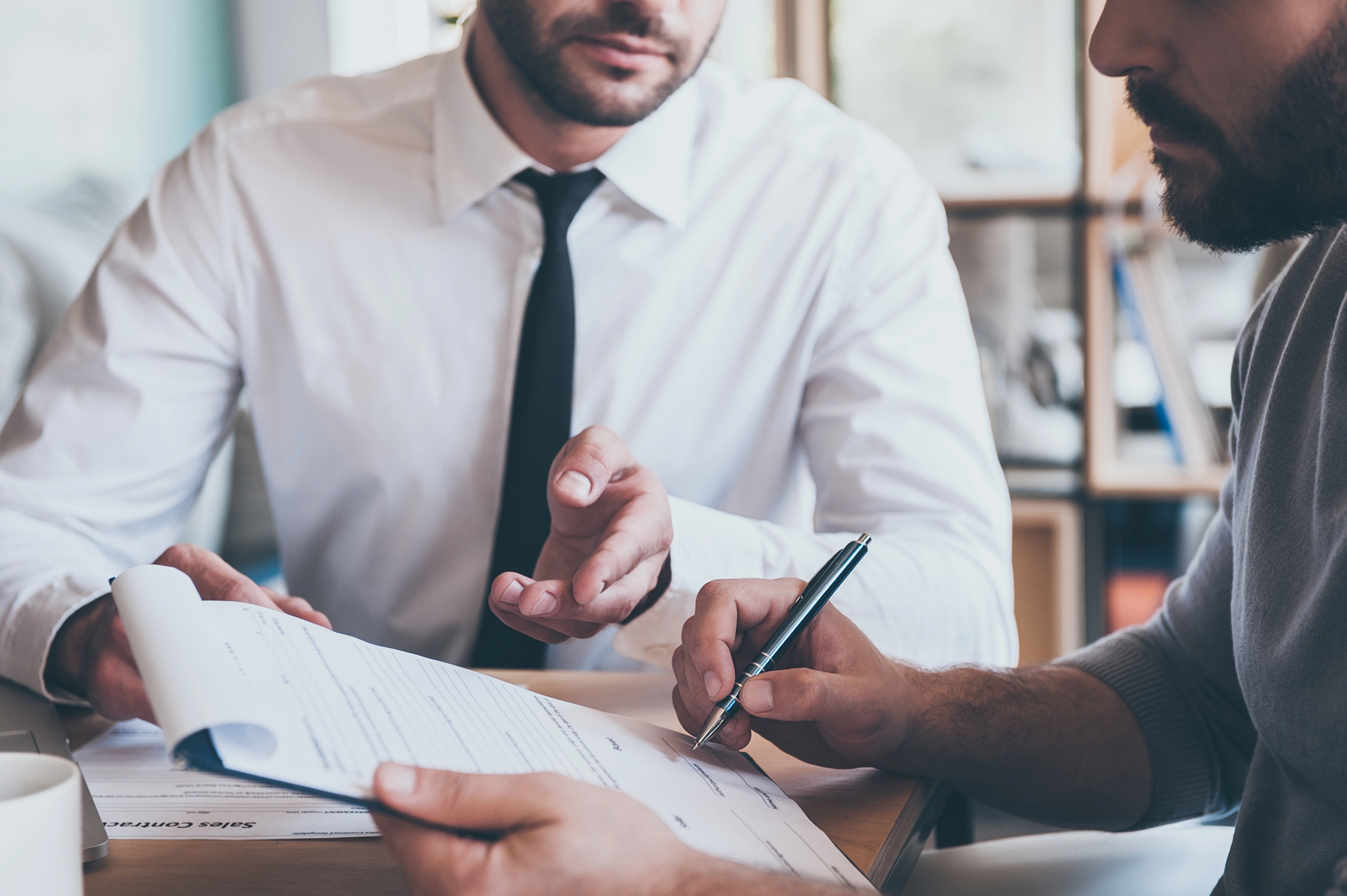 Ohio business owner reviewing commercial insurance agreement related to fire alarm compliance